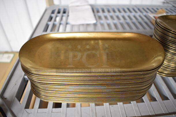 48 Gold Finish Metal Oval Plates. 9x4x0.25. 48 Times Your Bid!
