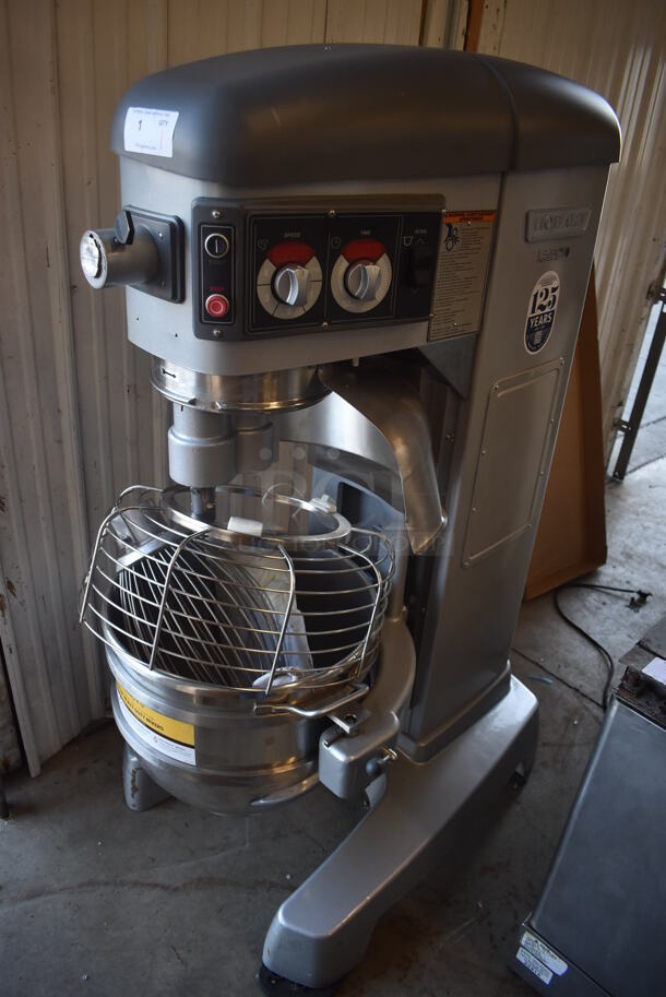 BRAND NEW SCRATCH AND DENT! Hobart HL600 Metal Commercial Floor Style 60 Quart Planetary Mixer w/ Stainless Steel Mixing Bowl, Bowl Guard, Whisk, Paddle and Dough Hook Attachments. 200-240 Volts, 1 Phase.