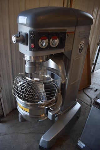 BRAND NEW SCRATCH AND DENT! Hobart HL600 Metal Commercial Floor Style 60 Quart Planetary Mixer w/ Stainless Steel Mixing Bowl, Bowl Guard, Whisk, Paddle and Dough Hook Attachments. 200-240 Volts, 1 Phase.