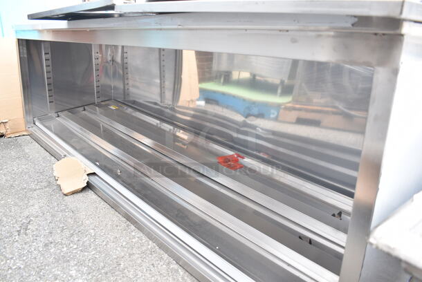 BRAND NEW SCRATCH AND DENT! Regency 600EBTB3096D 30" x 96" 16 Gauge Type 304 Stainless Steel Enclosed Base Sliding Door Table with Adjustable Midshelf and 6" Backsplash - Image 3 of 7