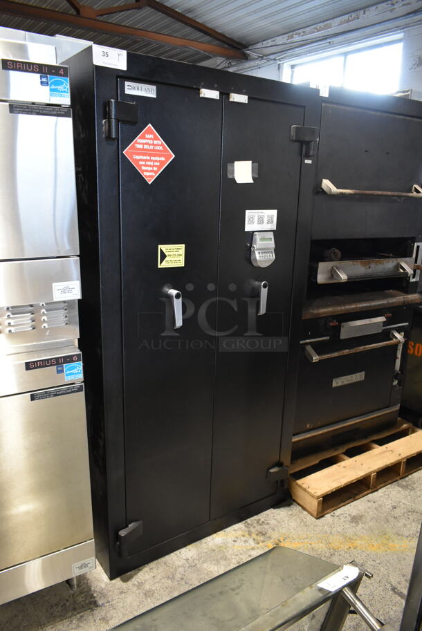 Rolland Black Metal 2 Door Reach In Safe. Comes w/ Combination - Has Not Been Verified By Our Team. 