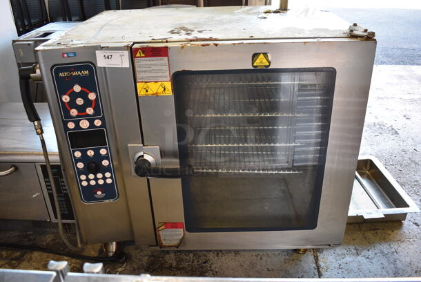 2012 Alto Shaam Model 10.10 ES Stainless Steel Commercial Electric Powered Combitherm Convection Oven w/ View Through Door and Metal Oven Racks. 208-240 Volts, 3 Phase. 45x31.5x39