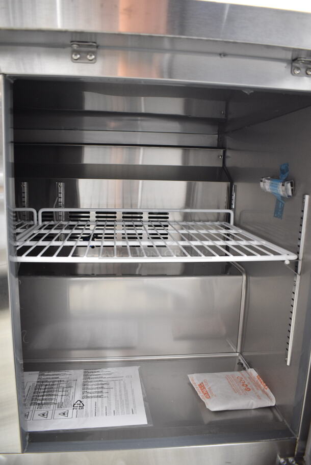 BRAND NEW SCRATCH AND DENT! 2024 Avantco 178SSUC48FHC Stainless Steel Commercial 2 Door Undercounter Freezer on Commercial Casters. 115 Volts, 1 Phase. Tested and Working!  - Image 4 of 6