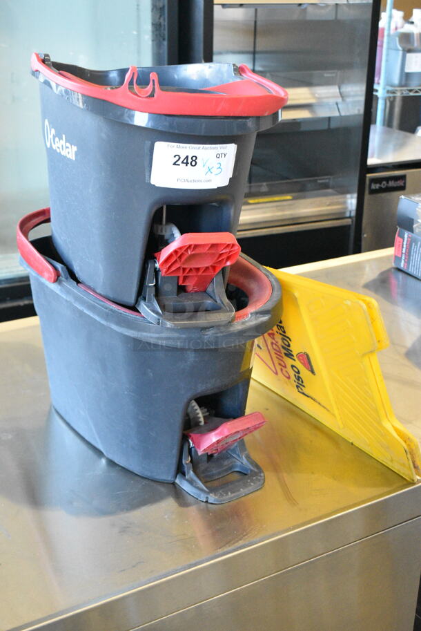 3 Items Including 2 Cedar Mop Buckets and Yellow Poly Wet Floor Caution Sign. 3 Times Your Bid!  - Image 1 of 6