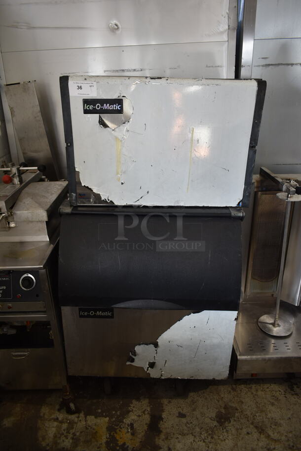 2011 Ice-O-Matic ICE0400FA4 Stainless Steel Commercial Ice Machine Head w/ Ice-O-Matic B40PSB Commercial Ice Bin on Commercial Casters.