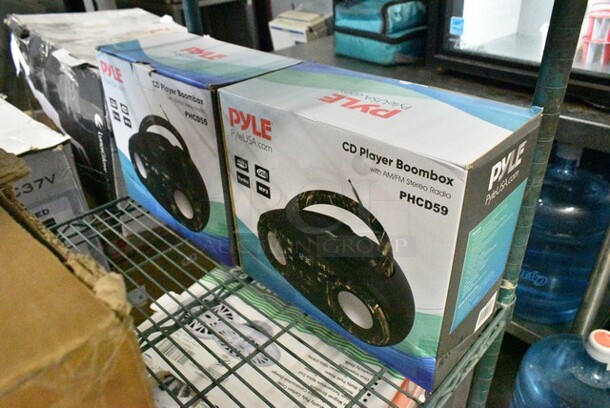 6 Various Items Including Pyle PT694BT.5 5.2-Channel Hi-Fi Bluetooth Stereo Amplifier 1000 Watt AV Home Speaker Subwoofer Sound Receiver w/Radio, Pyle PKSCRD308 Compact Pro Live Broadcast Sound Card, Pyle PDWR30B Outdoor Waterproof Speaker System, 2 Pyle PHCD59 CD Player Boombox. 6 Times Your Bid!  - Image 6 of 7