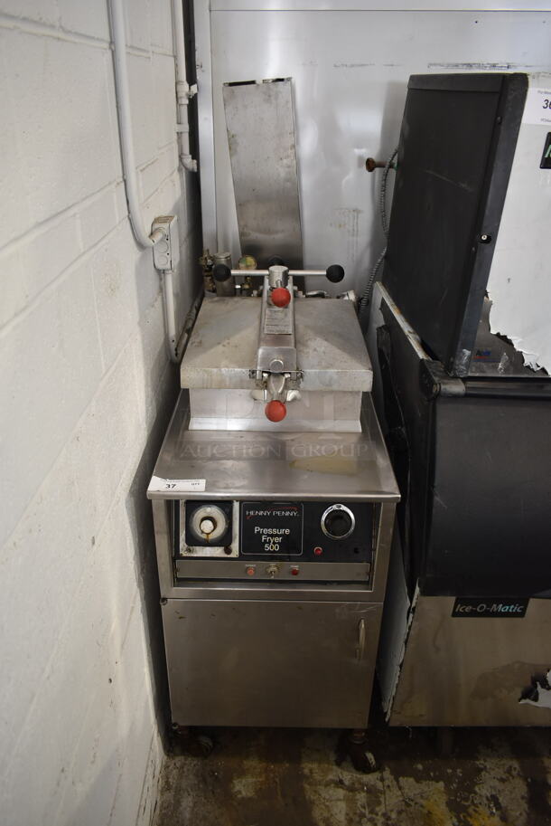 Henny Penny 500 Stainless Steel Commercial Floor Style Electric Powered Deep Fat Pressure Fryer on Commercial Casters. 220 Volts, 3 Phase. 