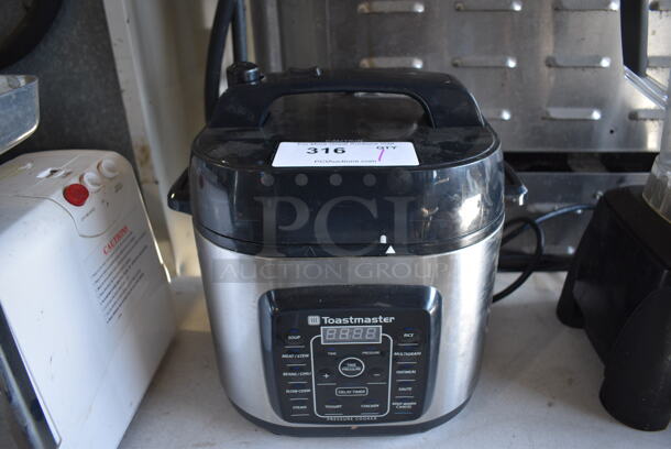 Toastmaster Model TM-670PC Chrome Finish Countertop 6 Quart Electric Pressure Cooker. 120 Volts, 1 Phase. 12x10x13