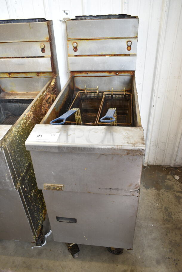 Pitco Frialator SG14 Stainless Steel Commercial Floor Style Natural Gas Powered Deep Fat Fryer w/ 2 Metal Fry Baskets on Commercial Casters. 110,000 BTU.  - Image 1 of 6