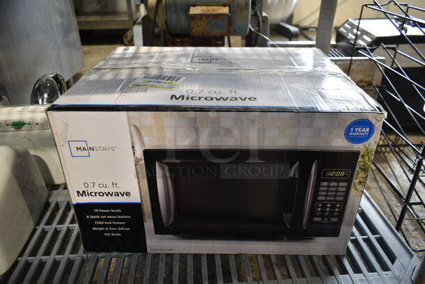IN ORIGINAL BOX! MainStays EM720CGA-B Countertop Microwave Oven. 120 Volts, 1 Phase.