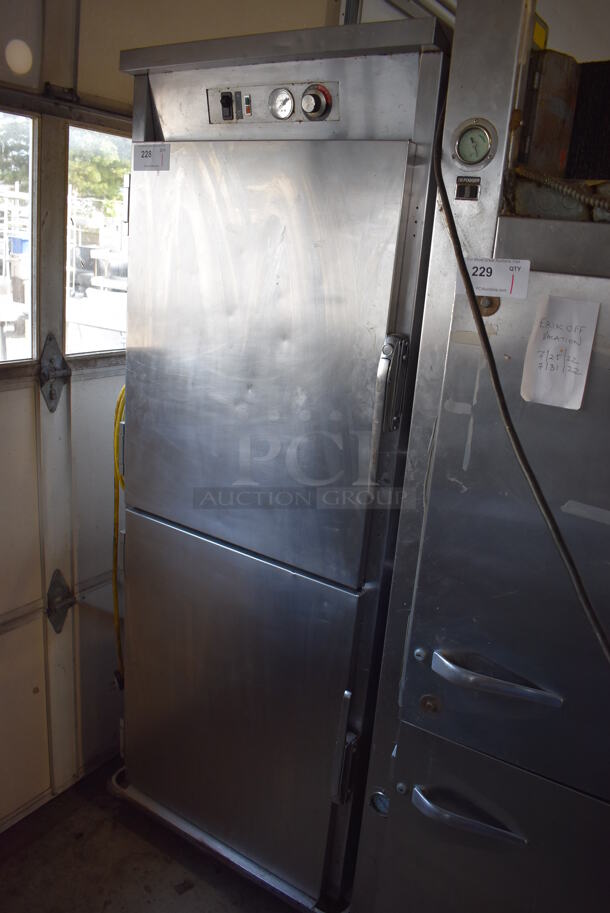 Stainless Steel Commercial 2 Half Size Door Heated Holding Cabinet w/ Thermostatic Controls on Commercial Casters. 31x34x77. Powers On But Does Not Get Warm