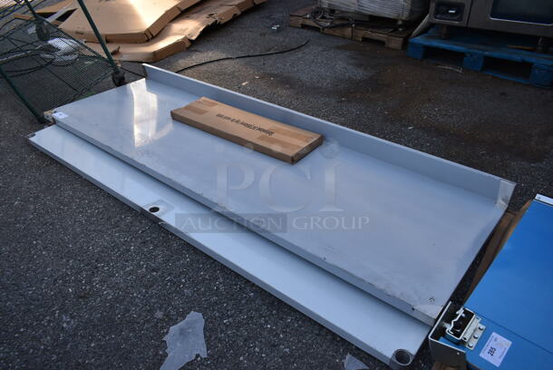 BRAND NEW SCRATCH AND DENT! Regency 600TB3096G 30" x 96" 18-Gauge 304 Stainless Steel Commercial Work Table with 4" Backsplash and Galvanized Undershelf - Image 3 of 6