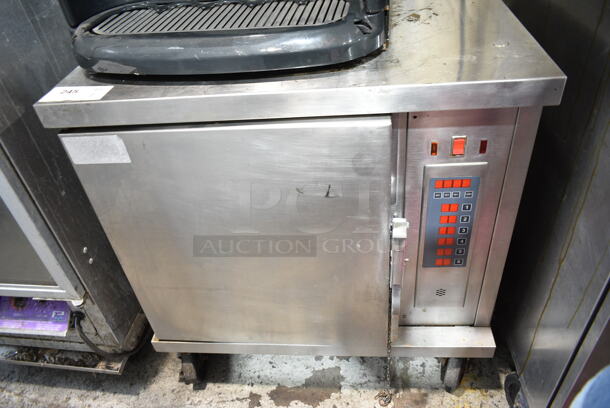 Wells M4200-3 Stainless Steel Commercial Electric Powered Half Size Convection Oven on Commercial Casters. 208/240 Volts. - Item #1114279