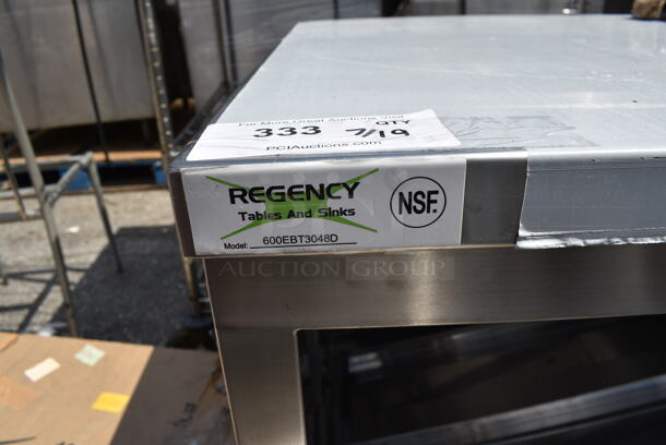 BRAND NEW SCRATCH AND DENT! Regency 600EBT3048D 30" x 48" 16 Gauge Type 304 Stainless Steel Enclosed Base Table with Sliding Doors and Adjustable Midshelf - Image 7 of 7