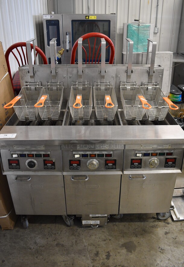 Keating Model 14TFMRI Stainless Steel Commercial Floor Style Natural Gas Powered 3 Bay Instant Recovery Deep Fat Fryer w/ Filtration System and 6 Metal Fry Baskets on Commercial Casters. 46x31.5x55