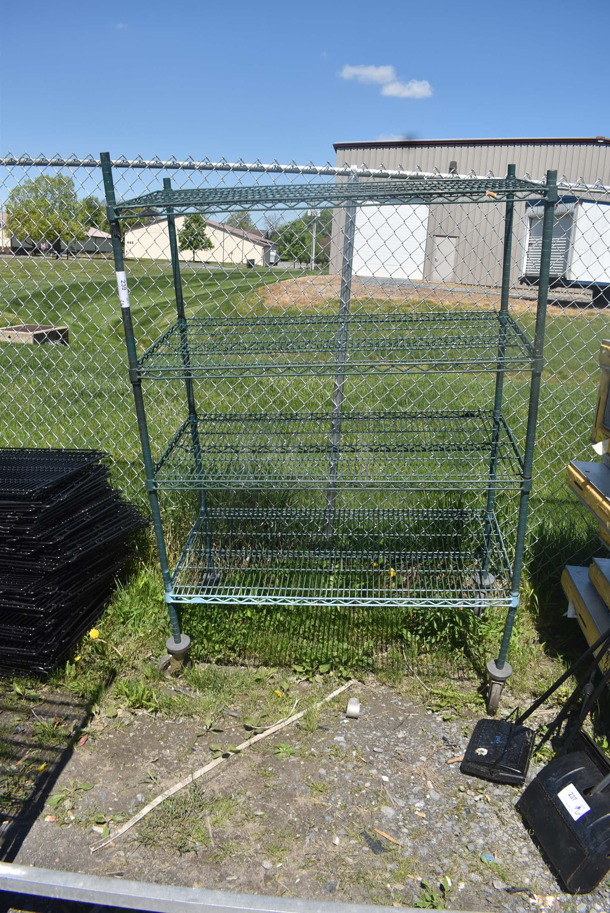 Green 4 Tier Metro Style Shelf on Casters BUYER MUST DISMANTLE. PCI CANNOT DISMANTLE FOR SHIPPING. PLEASE CONSIDER FREIGHT CHARGES. - Image 1 of 4