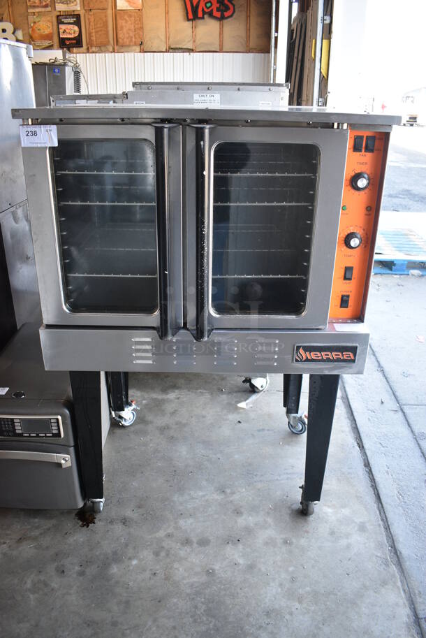 Sierra Stainless Steel Commercial Natural Gas Powered Full Size Convection Oven w/ View Through Doors, Metal Oven Racks and Thermostatic Controls on Metal Legs w/ Commercial Casters. 38x33x58.5
