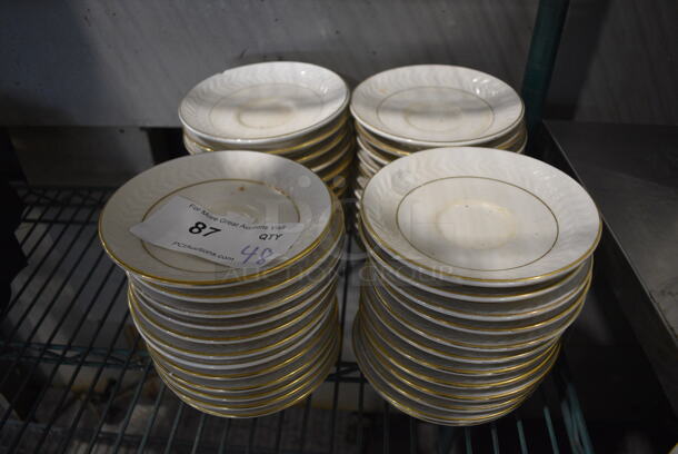 48 White Ceramic Saucers w/ Gold Line on Rim. 5.75x5.75x1. 48 Times Your Bid!