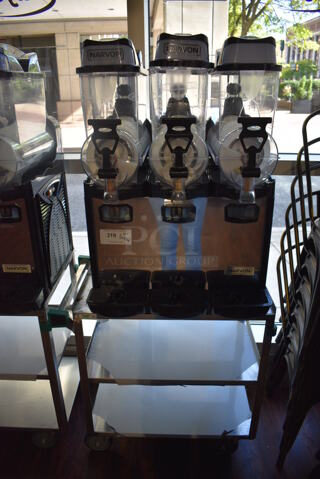 Narvon OASIS 3-10 Stainless Steel Commercial Countertop 3 Hopper Slushie Machine on Stainless Steel 3 Tier Cart. 23x21x33, 19x31x31. Item Was in Working Condition on Last Day of Business. (lounge)