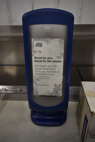 BRAND NEW IN BOX! Tork Blue and Clear Poly Napkin Dispenser.