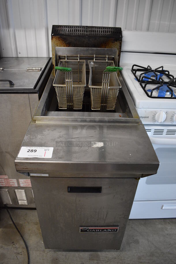 Garland Model M35SS Stainless Steel Commercial Floor Style Natural Gas Powered Deep Fat Fryer w/ 2 Metal Fry Baskets on Commercial Casters. 17x38x46