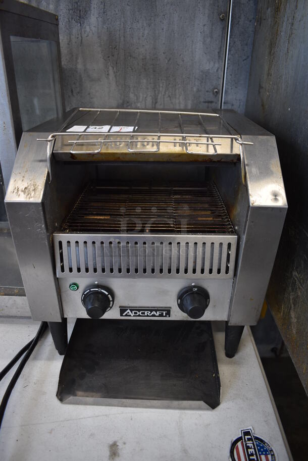 Adcraft Model CYT-120 Stainless Steel Commercial Countertop Electric Powered Conveyor Toaster Oven. 120 Volts, 1 Phase. 15x17x16. Tested and Powers On And Gets Hot But Parts Do Not Move