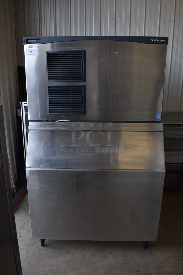 Scotsman Model C1448SA-32B Stainless Steel Commercial Ice Machine on Commercial Ice Bin. 208/230 Volts, 1 Phase. 48x34x78.5