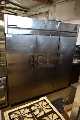 True TA3R-3S Stainless Steel Commercial 3 Door Reach In Cooler on Commercial CAsters. 115 Volts, 1 Phase. Tested and Working!