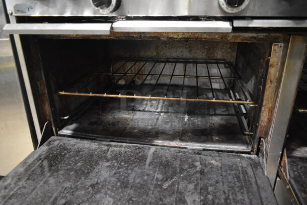 Garland SunFire Stainless Steel Commercial Natural Gas Powered 6 Burner Range w/ Right Side Flat Top Griddle, 2 Ovens, Over Shelf and Back Splash. - Image 6 of 7