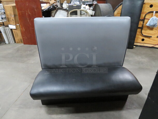 One Single Sided Booth With A Black Cushioned Seat And A Grey Cushioned Back. 48X25X42