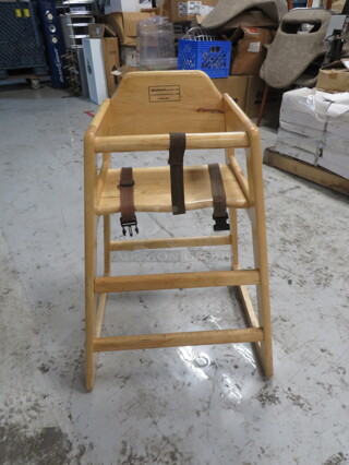 One Wooden High Chair With Safety Straps.