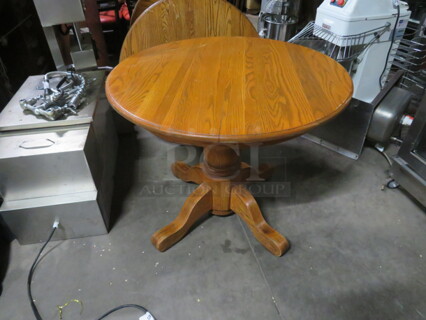 One 36 Inch Round Solid Oak Table On A Solid Oak Base. 36X36X30