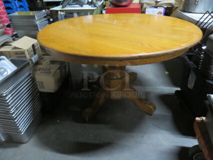 One 48 Inch Round Solid Oak Table On A Solid Oak Base. 48X48X30
