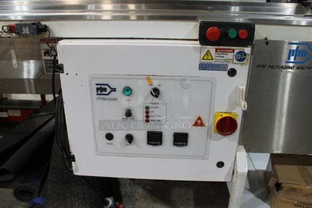 PFM Packaging 30 M Metal Commercial Floor Style Horizontal Form Fill and Seal / Horizontal Flow Wrapper Machine on Commercial Casters. 220 Volts, 1 Phase.  - Image 8 of 11