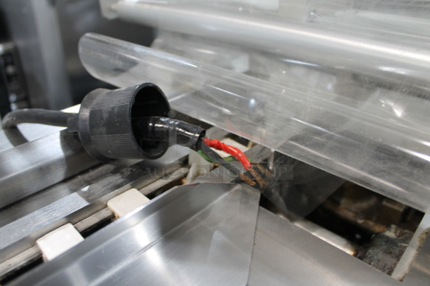 PFM Packaging 30 M Metal Commercial Floor Style Horizontal Form Fill and Seal / Horizontal Flow Wrapper Machine on Commercial Casters. 220 Volts, 1 Phase.  - Image 11 of 11