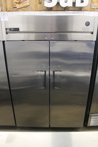 2015 True TG2R-2S ENERGY STAR Stainless Steel Commercial 2 Door Reach In Cooler w/ Poly Coated Racks on Commercial Casters. 115 Volts, 1 Phase. Tested and Working!