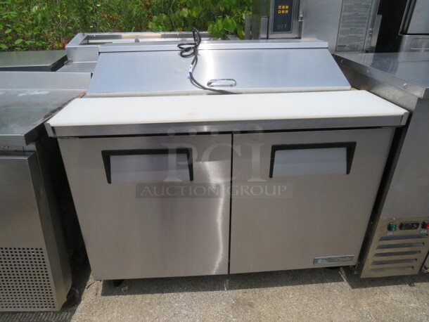 One True 2 Door Refrigerated Prep Table With Cutting Board, And 4 Racks On Casters. 115 Volt. Model# TSSU-48-12-HC. 48X30X43. $3825.00 - Image 1 of 3