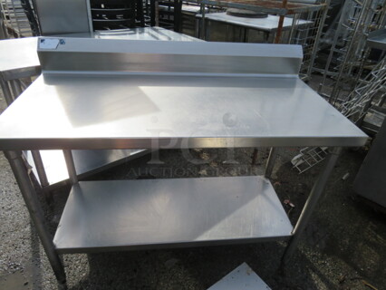 One Stainless Steel Table With Stainless Steel Under Shelf And Backsplash. 48X24X40