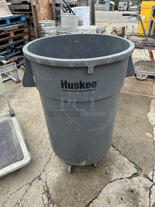 One Huskee Trash Can On Dolly. - Image 1 of 1