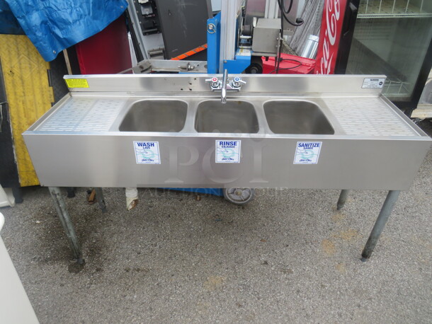 One SS Krowne 3 Compartment Bar Sink With R/L Drain Board, Back Splash, And Faucet. Model# 18-534. 60X18X33