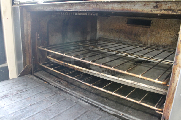 Stainless Steel Commercial Natural Gas Powered 6 Burner Range w/ Oven, Over Shelf and Back Splash on Commercial Casters. - Image 5 of 6