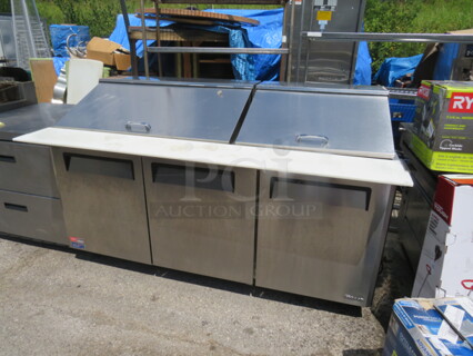 One 3 Door Turbo Air Refrigerated Prep Table With 2 Racks, And A Cutting Board On Casters. Model# MST-72-30M. 115 Volt. 73X38X45.