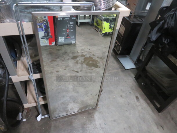 One 18X36 Stainless Steel Framed Mirror.