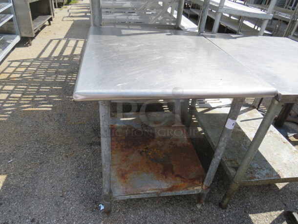 One Stainless Steel Table With Under Shelf. 35X30X34