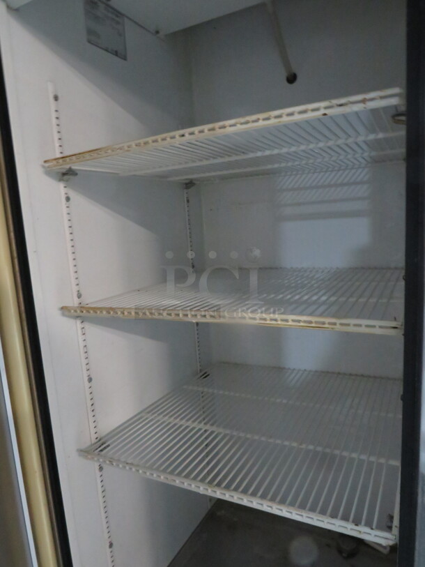 One WORKING True Glass Door refrigerator With 3 Racks On Casters. Model# T-23G. 115 Volt. 27X30X82. $4244.40. - Image 2 of 3