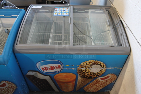 AHT RIO S 100 Metal Commercial Chest Freezer Merchandiser on Commercial Casters. 120 Volts, 1 Phase. Tested and Working!