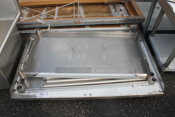BRAND NEW SCRATCH AND DENT! Stainless Steel Commercial Tabletop w/ 2 Under Shelves and Legs. - Image 1 of 3