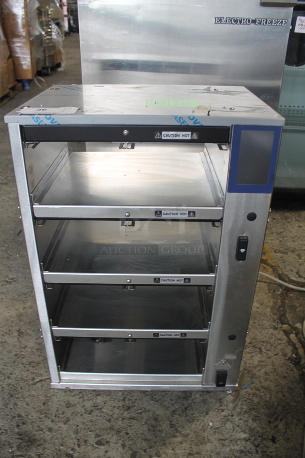 BRAND NEW! 2022 Duke RFHU-42-120H2 Stainless Steel Commercial Countertop 4 Tier Warming Holding Display Case. 120 Volts, 1 Phase. Tested and Working! - Image 1 of 5