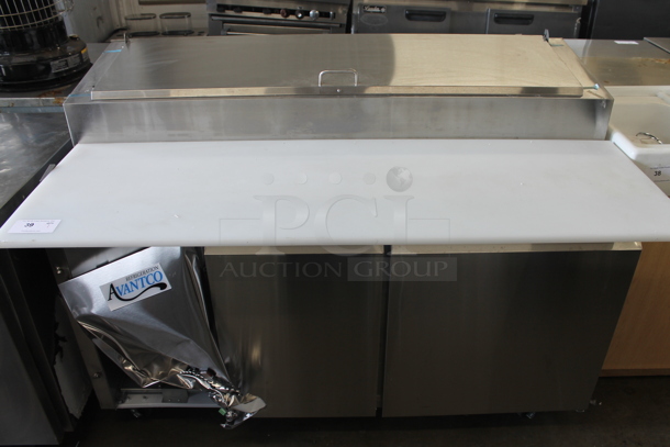 BRAND NEW SCRATCH AND DENT! 2023 Avantco 178SSPPT260 Stainless Steel Commercial Pizza Prep Table on Commercial Casters. 115 Volts, 1 Phase. Tested and Does Not Power On - Image 1 of 9