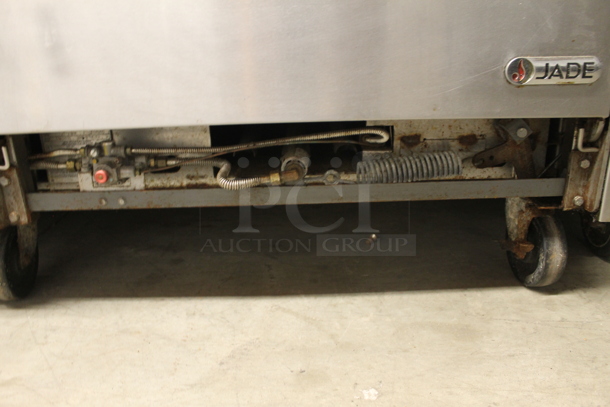 Jade Commercial Stainless Steel Heavy Duty Natural Gas Powered Range With Griddle Top And Standard Oven With Steel Racks On Commercial Casters. - Image 7 of 8